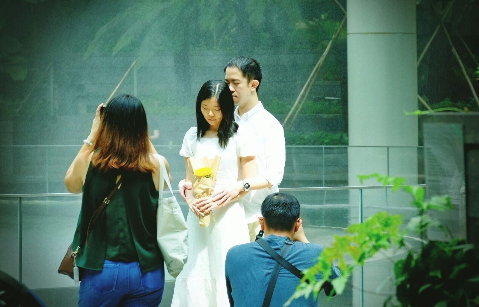 man in white dress shirt holding drinking glass